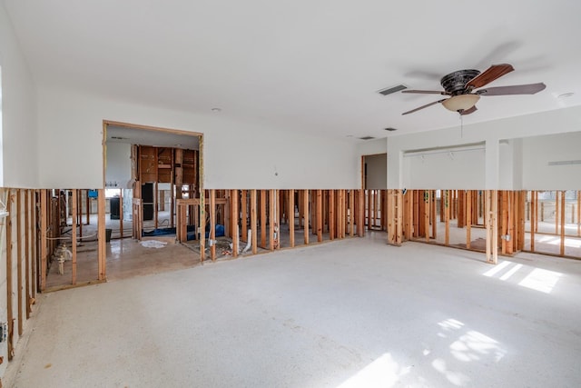 unfurnished room featuring visible vents and a ceiling fan