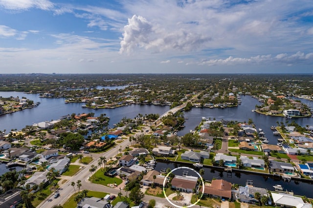 birds eye view of property with a water view and a residential view