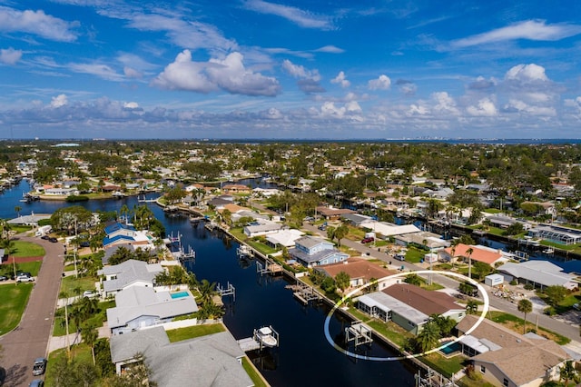 birds eye view of property with a residential view and a water view