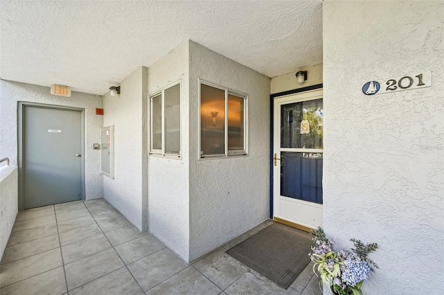 1050 Riverside Dr Unit A201, Palmetto, FL 34221 - doorway to property with stucco siding