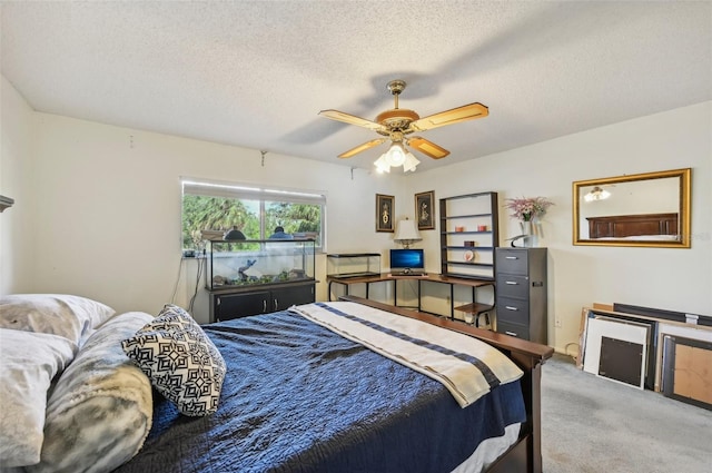 1050 Riverside Dr Unit A201, Palmetto, FL 34221 - bedroom with carpet floors, a textured ceiling, a ceiling fan, and a desk