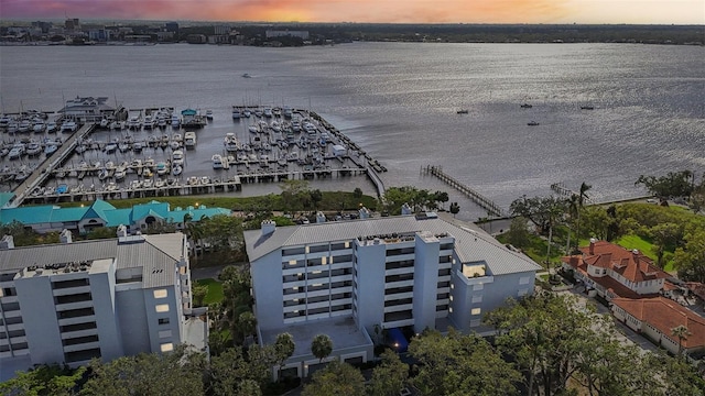 aerial view at dusk with a water view