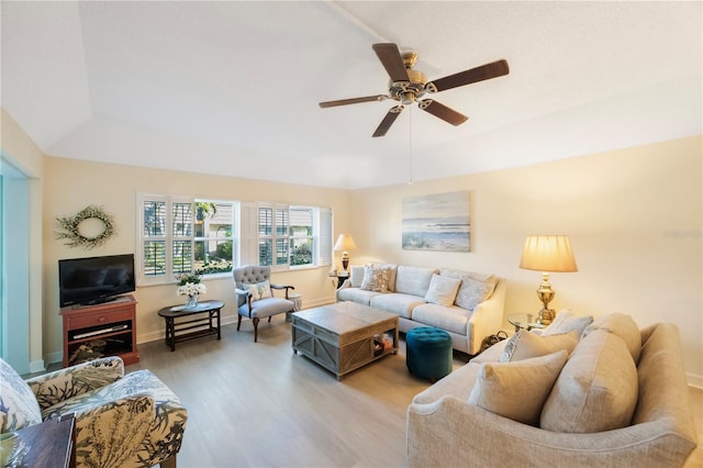 living room featuring light wood-type flooring, lofted ceiling, and ceiling fan