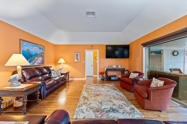 living room with light hardwood / wood-style flooring