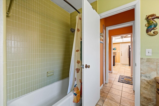 bathroom featuring tile patterned flooring and shower / bath combination with curtain