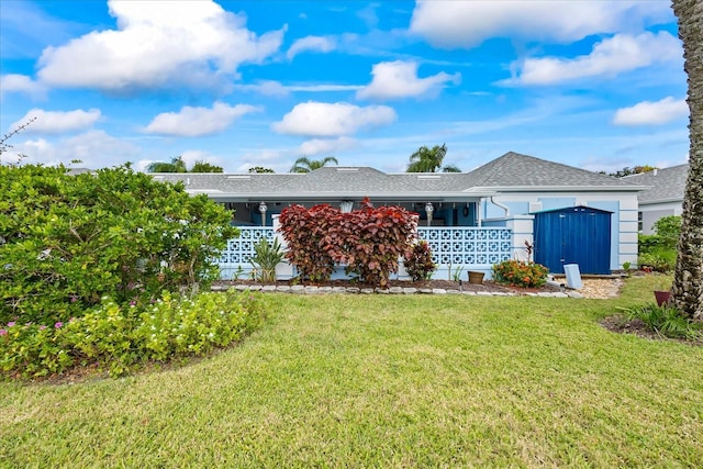 ranch-style house with a front yard