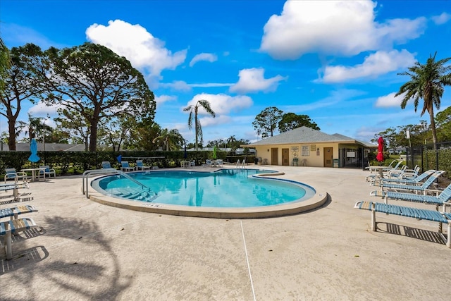 view of swimming pool featuring a patio area