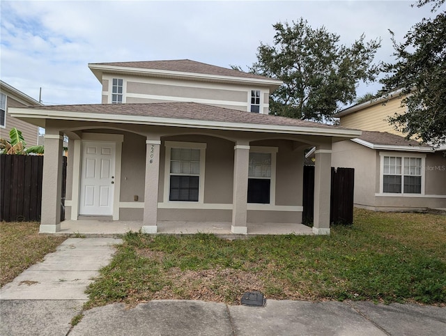 bungalow with a front lawn and covered porch