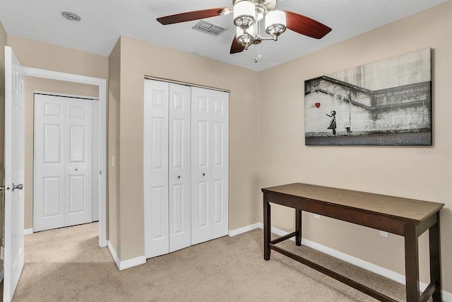 411 S Fremont Ave Unit B, Tampa, FL 33606 - bedroom featuring carpet floors, baseboards, a closet, and a ceiling fan