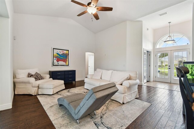 living room featuring high vaulted ceiling, dark hardwood / wood-style floors, ceiling fan, and french doors