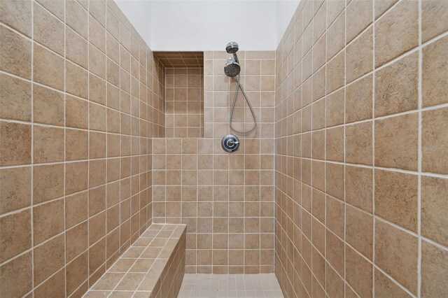 bathroom with tiled shower