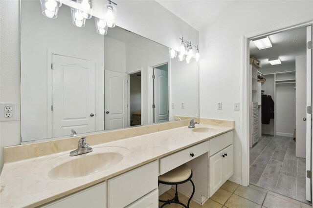 bathroom with vanity and tile patterned flooring