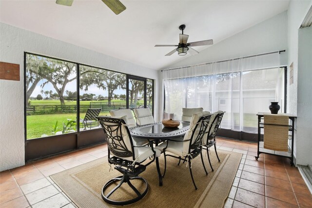 sunroom / solarium with ceiling fan and lofted ceiling