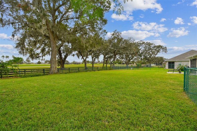 view of yard with a rural view