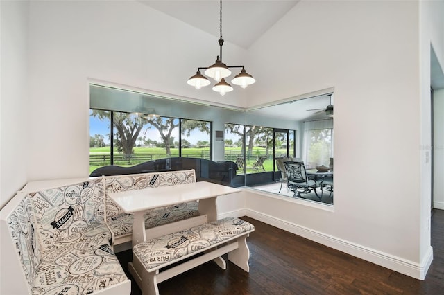 sitting room with hardwood / wood-style flooring and high vaulted ceiling