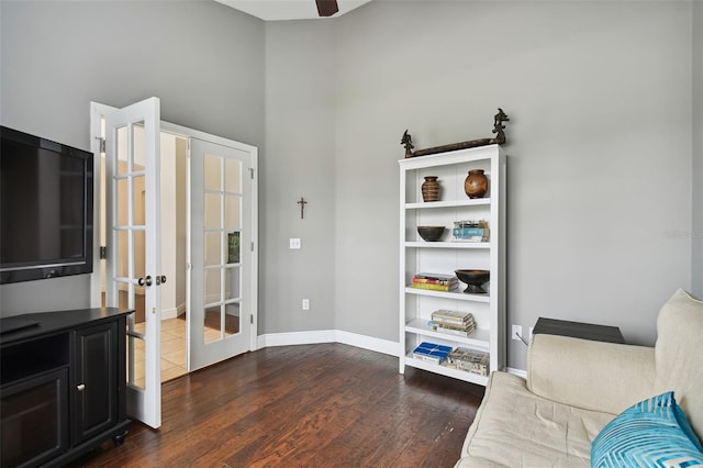 living area with french doors and dark hardwood / wood-style flooring