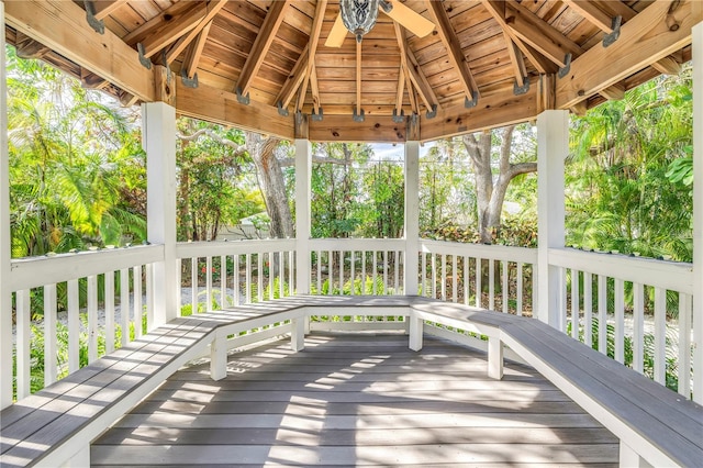 wooden deck with a gazebo and ceiling fan