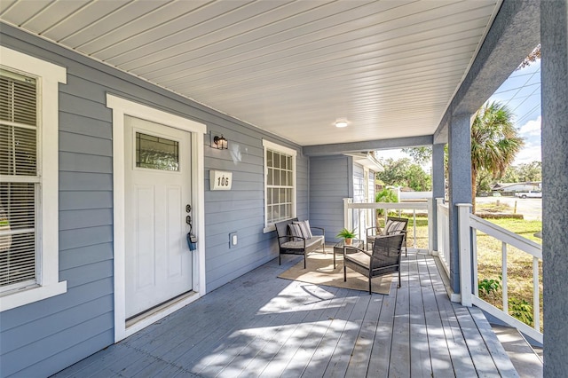 wooden terrace with a porch