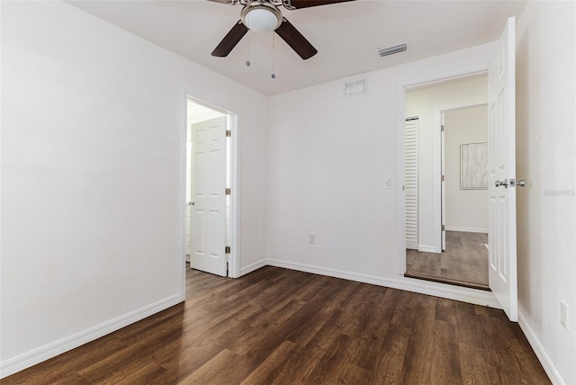 unfurnished bedroom with ceiling fan and dark hardwood / wood-style floors