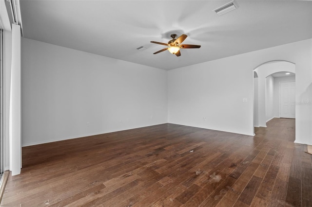 spare room featuring dark hardwood / wood-style flooring and ceiling fan