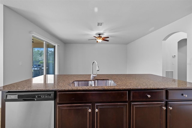 kitchen featuring ceiling fan, sink, light stone counters, and dishwasher