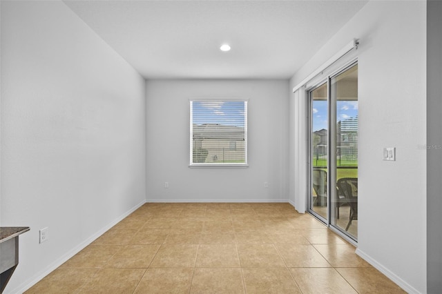 tiled empty room with plenty of natural light