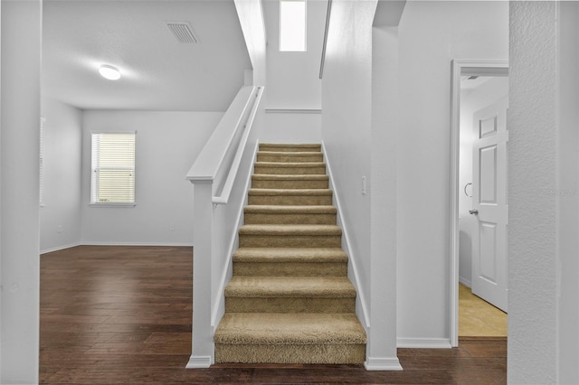 stairway with wood-type flooring