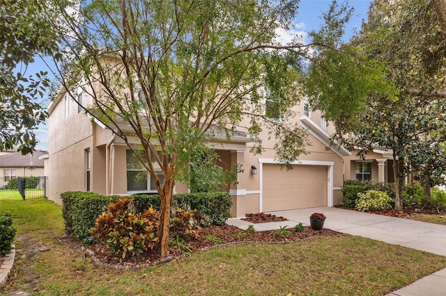 view of front of house featuring a front lawn and a garage