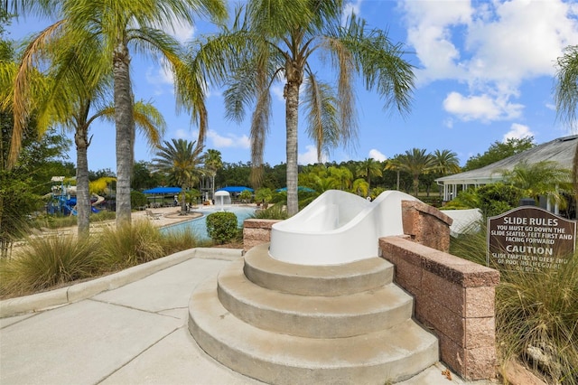 view of patio featuring a pool