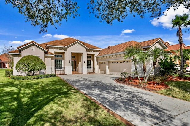 mediterranean / spanish-style home with a garage and a front lawn