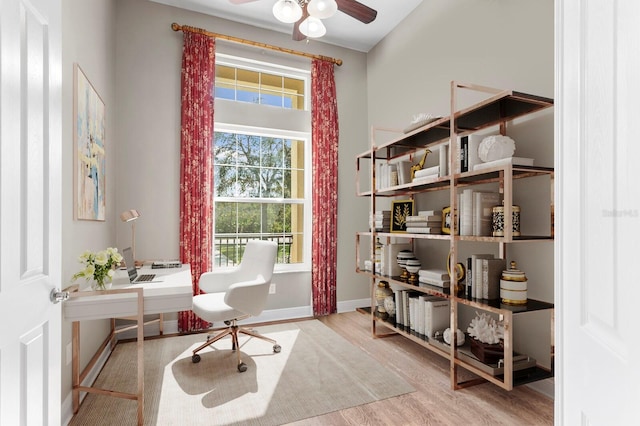 office space featuring ceiling fan and light hardwood / wood-style floors