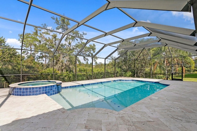 view of pool featuring an in ground hot tub, a patio, and a lanai