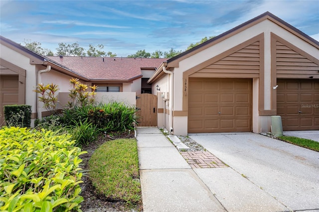 ranch-style house featuring a garage