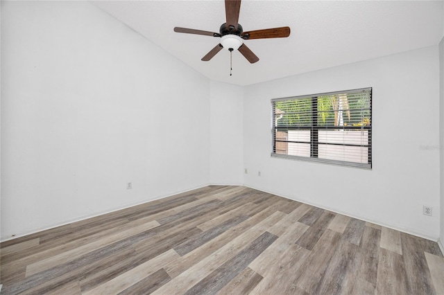 unfurnished room with a ceiling fan and wood finished floors