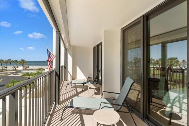 balcony featuring a water view