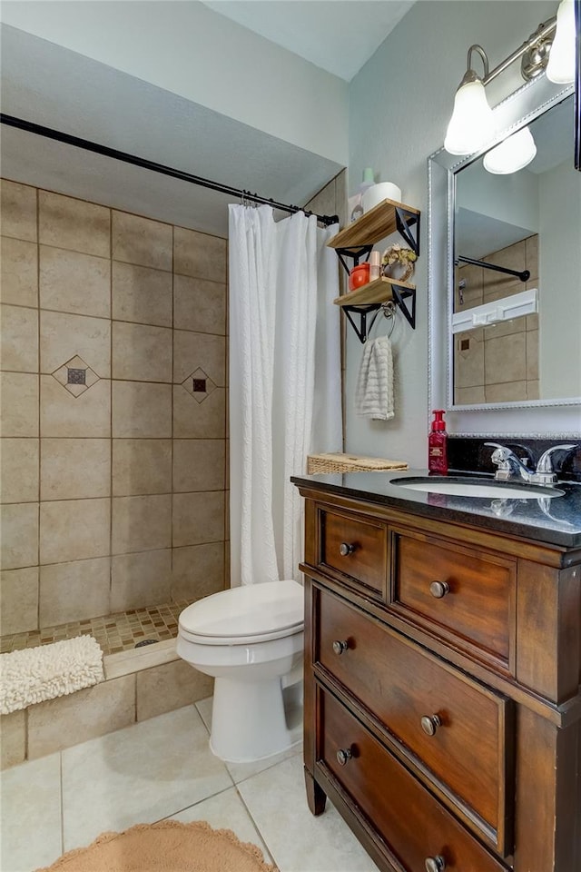 bathroom with tile patterned floors, vanity, curtained shower, and toilet