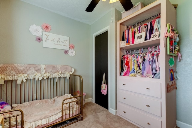 carpeted bedroom featuring ceiling fan