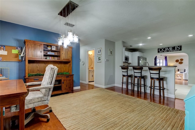 office area with light hardwood / wood-style flooring