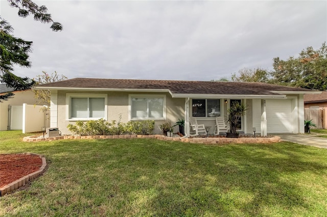 ranch-style house featuring a garage and a front yard