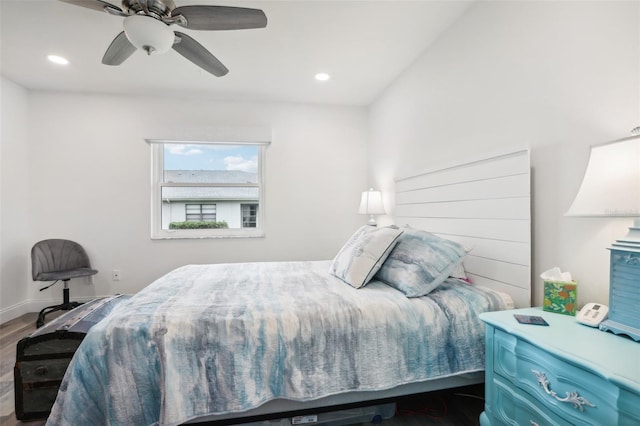 bedroom with hardwood / wood-style flooring and ceiling fan