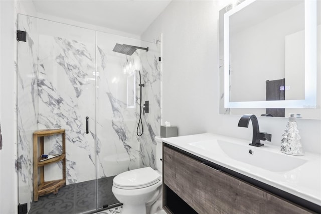 bathroom featuring toilet, an enclosed shower, and vanity