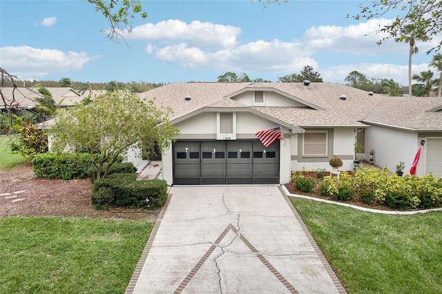 ranch-style home featuring a garage and a front yard