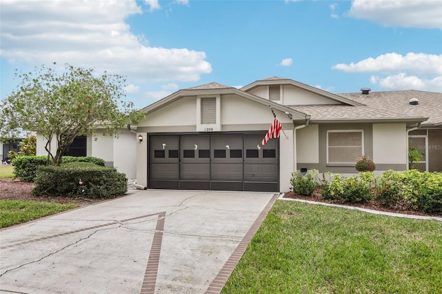 single story home with a garage and a front yard