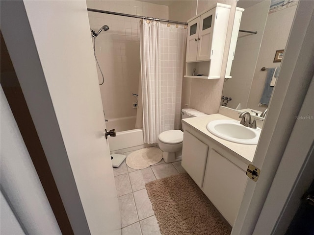 full bathroom featuring toilet, vanity, shower / bath combination with curtain, and tile patterned flooring