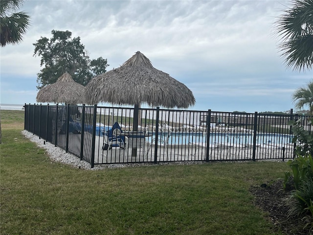 view of pool featuring a yard and a gazebo