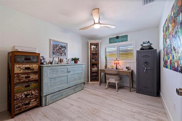 office space featuring light hardwood / wood-style floors and ceiling fan