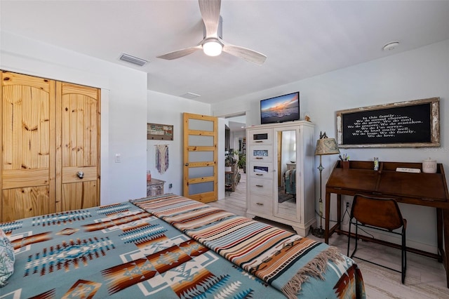 bedroom with ceiling fan and light hardwood / wood-style flooring