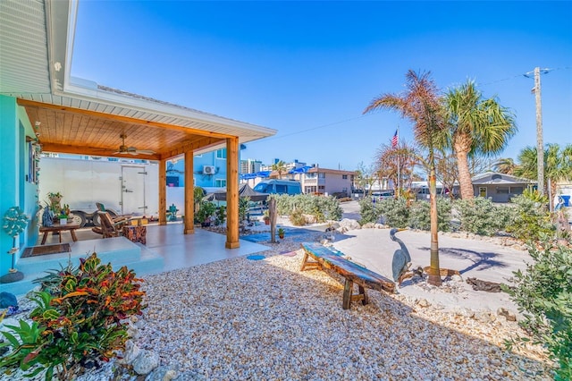 view of yard featuring a patio and ceiling fan