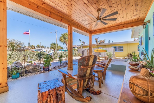 view of patio with fence and ceiling fan