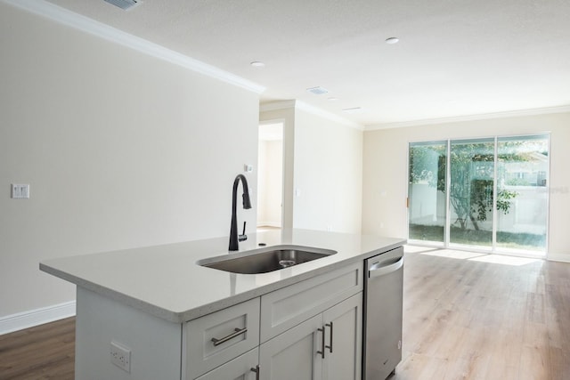 kitchen with stainless steel dishwasher, sink, a kitchen island with sink, and ornamental molding